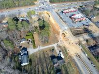Aerial view of property near a busy road intersection at 1229 Tulip St, Clayton, NC 27520