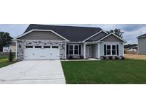 Exterior view of a charming ranch home with a two-car garage and stone accents at 215 Merrifield Ln, Garner, NC 27529