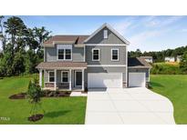 Two-story home with gray siding, two-car garage, and landscaped yard at 110 Cribbs Ln, Middlesex, NC 27557