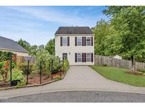 Two-story house with a landscaped front yard and a paved driveway at 5504 Skylock Dr, Raleigh, NC 27610