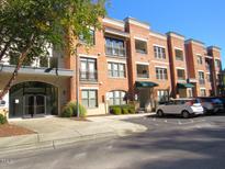 Brick building exterior with parking and landscaping at 7250 Nc 751 Hwy # 2101, Durham, NC 27707