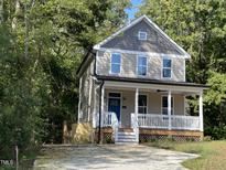 Two-story craftsman style home with front porch at 705 Jefferson St, Henderson, NC 27536