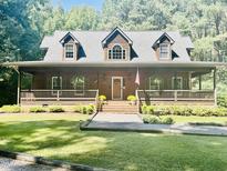 Two story home with wraparound porch and landscaping at 1150 Old County Home Rd, Nashville, NC 27856
