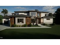 Modern two-story home with stone and siding exterior at 2209 Paddstowe Main Way, Wake Forest, NC 27587