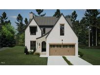 Two-story home with stone and white siding at 3301 Dell Dr, Raleigh, NC 27609