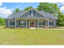 Gray farmhouse exterior with front porch and landscaping at Tbd 2 Cedar Lane Rd, Sanford, NC 27332