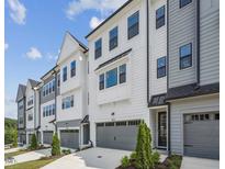 Row of modern townhouses with attached garages at 4816 Cypress Tree Ln, Raleigh, NC 27612