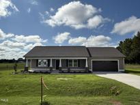 Charming one-story house with a two-car garage at 139 Grace Ridge Ct, Benson, NC 27504