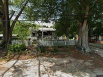 Cute ranch home with brick facade and two car garage at 18 S Hillsborough St, Franklinton, NC 27525