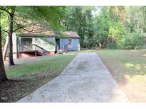 House exterior with driveway and landscaping at 3404 Gemini Dr, Raleigh, NC 27604