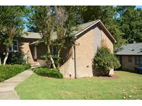 Brick home with a well maintained lawn at 500 W Woodcroft Pkwy Pkwy # 8C, Durham, NC 27713