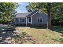 Gray house with a brick base and small yard at 503 Abbington Ct, Archer Lodge, NC 27527