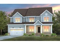 Two-story home with light gray siding, beige accents, and a two-car garage at 116 E Star Foal Ln, Wendell, NC 27591