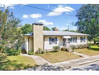 Ranch style home with a brick chimney and landscaped yard at 412 Hamby St, Clayton, NC 27520