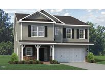 Two story house with gray siding, stone accents, and a three-car garage at 1938 Darrell Dr # 11, Graham, NC 27253