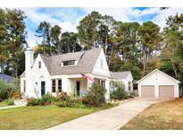 Charming white house with two car garage and landscaped lawn at 305 S Walnut St, Spring Hope, NC 27882