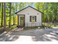 Charming cottage with a green door and window box at 117 Pinto Dr, Louisburg, NC 27549