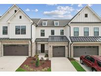 Modern townhome with two-car garage and landscaping at 171 Periwinkle Pl # 232, Clayton, NC 27527