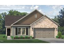 Brick front home with two-car garage and landscaping at 1926 Darrell Dr # 13, Graham, NC 27253
