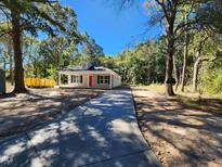 Newly built house with a red front door and concrete driveway at 910 West St, Smithfield, NC 27577