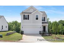 Two story house with gray siding and a white garage door at 169 Horseshoe Pl # 55P, Angier, NC 27501