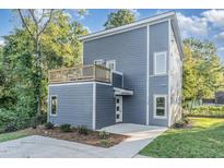 Modern two-story home with gray siding and a deck at 112 N Guthrie Ave # B, Durham, NC 27703