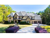 Stunning two-story home with stone accents and large driveway at 2117 Blue Haven Ct, Wake Forest, NC 27587