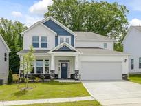 Two story home with blue and white siding at 236 Alden Way, Angier, NC 27501