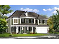 Two-story house with green siding, white columns, and a three-car garage at 3158 Alden Way, Angier, NC 27501