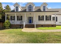 Two-story home with front porch and landscaped yard at 155 Foxglove Drive Dr, Garner, NC 27529