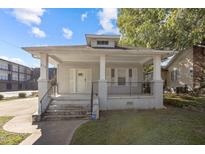 Charming bungalow style home with a front porch and well-maintained lawn at 810 E Edenton St, Raleigh, NC 27601