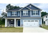 Two-story home with gray siding and white garage door at 333 Hopewell Branch Ct, Smithfield, NC 27577