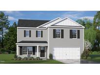 Two-story home with gray siding, white accents, and a two-car garage at 385 Swift Creek Farm Ln, Clayton, NC 27520