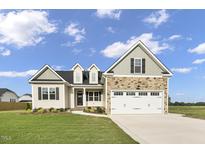 Two-story house with stone and beige siding at 45 S Harper Faith Way, Benson, NC 27504