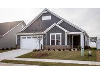 Gray house with white garage door and landscaping at 1724 Red Elm Lane, Homesite 76, Fuquay Varina, NC 27526