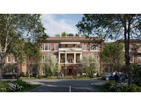 Brick building exterior with parking and landscaping at 2606 Marchmont St # 101, Raleigh, NC 27608