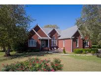 Brick house with large front yard and patio at 555 House Rd Rd, Kenly, NC 27542