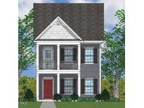 Two-story craftsman style home with gray siding and red door at 9228 Leaning Post Rd # 445, Wake Forest, NC 27587
