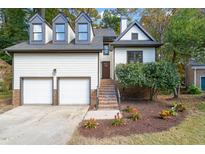 Two story home with two car garage and landscaping at 10000 Goodview Ct, Raleigh, NC 27613