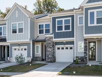 Three-unit townhome building, gray and blue exterior at 180 Norwell Ln, Pittsboro, NC 27312