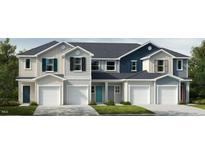 Three-unit townhome building with attached garages and modern exterior finishes at 1046 Mountain Crown St, Durham, NC 27703