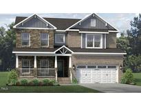 Two-story brick home with large windows and a three car garage at 1064 Tulloch Ct # 212, Burlington, NC 27215