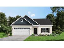 Two-story house with white brick and a dark blue roof at 301 Barhams Mill Pond Lane, Wendell, NC 27591