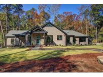 Stunning brick home with modern design and landscaping at 1414 Whippoorwill Ln, Chapel Hill, NC 27517