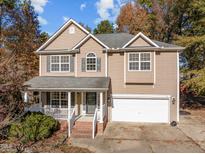 Two-story house with attached garage and porch at 1608 Irving Place, Creedmoor, NC 27522