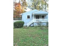 Cozy light blue ranch home with a front porch at 327 Ranch Farm Rd, Raleigh, NC 27603