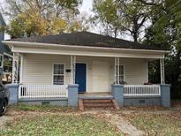 Small bungalow with a front porch at 1206 Gearwood Avenue # A & B, Durham, NC 27701