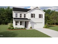 Two-story farmhouse style home with white siding, black roof, and landscaping at 662 Barbour Farm Ln, Four Oaks, NC 27524