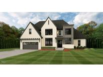 Elegant two-story home with a covered entry and attached garage at 5025 Quail Hollow Dr, Raleigh, NC 27609