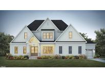 Two-story farmhouse with white siding, brick accents, and a three-car garage at 370 Bellini Dr, Clayton, NC 27527
